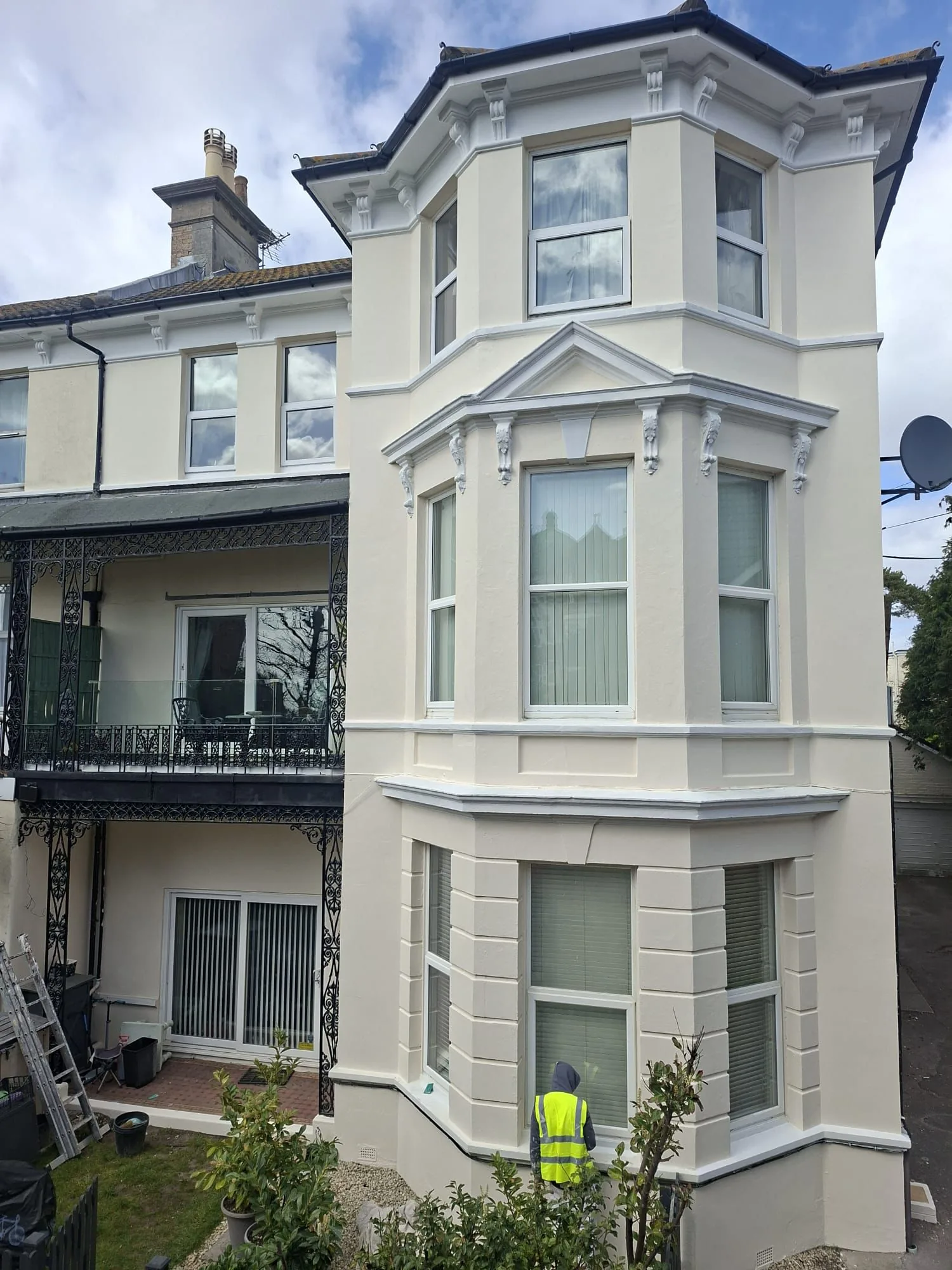 Completed exterior painting on a block of flats in Boscombe with restored masonry, painted bay windows and balcony railings