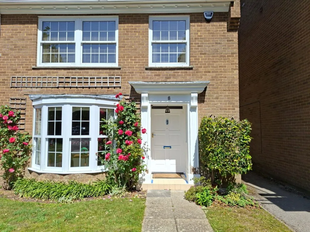 Exterior decorating on a bay-fronted terraced home in Winton