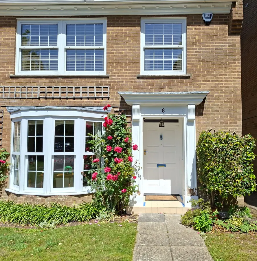 Freshly painted door surround, bay window and timber on a home in Bransgore